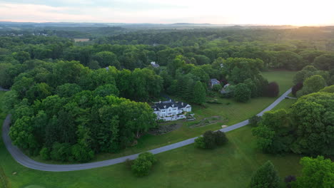 aerial push in on massive family estate