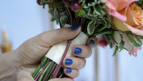 girl making bouquet of flowers in slow motion