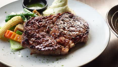 beef steaks meat with vegetables on a plate