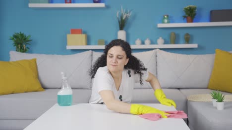 angry young woman throwing rags.