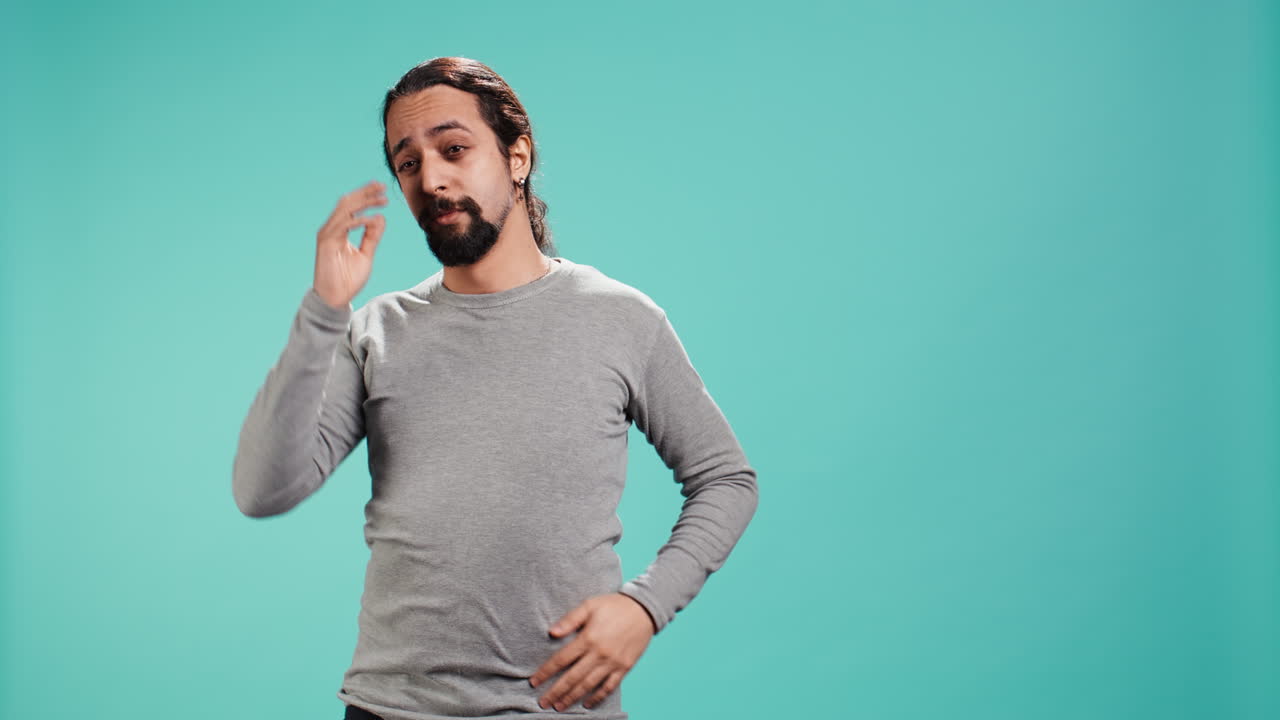 Man feeling exhausted and yawning, covering his mouth