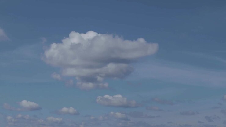 Timelapse of clouds moving and rolling on a blue and sunny sky, becoming dark and stormy. Summer time, western Europe