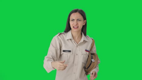 Angry-Indian-female-police-officer-calling-someone-Green-screen