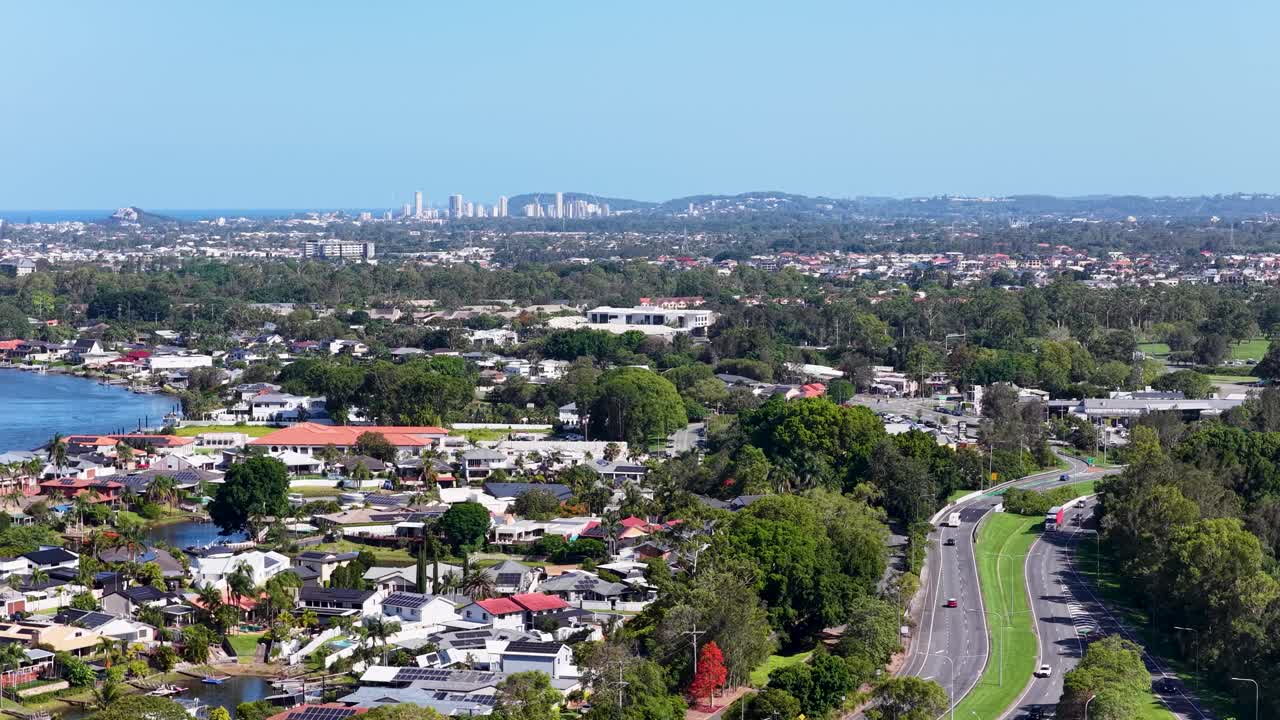 Aerial view of a suburban area with a cityscape in the background