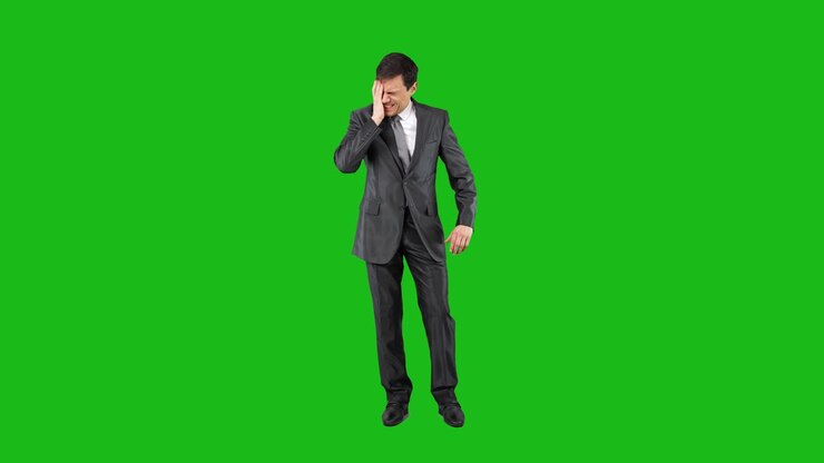 Businessman Experiencing Discomfort or Headache on Green Screen