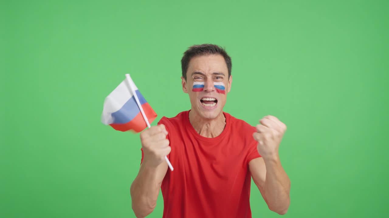 Man cheering for Russia screaming and waving a national flag
