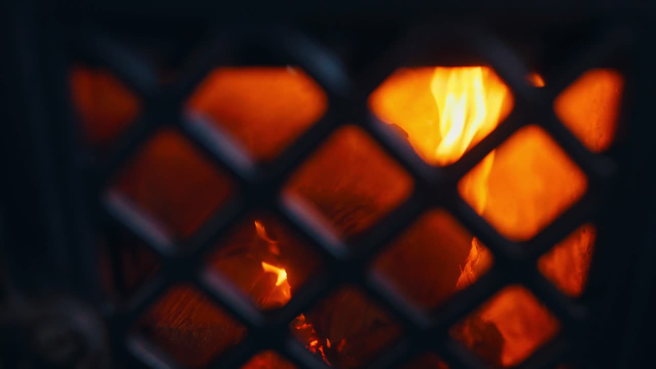 Blazing Flames Inside Cast Iron Antique Fireplace. Close-up Shot