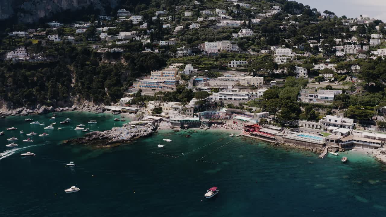 Aerial view of Italy's densely populated shoreline with tourist filled beaches