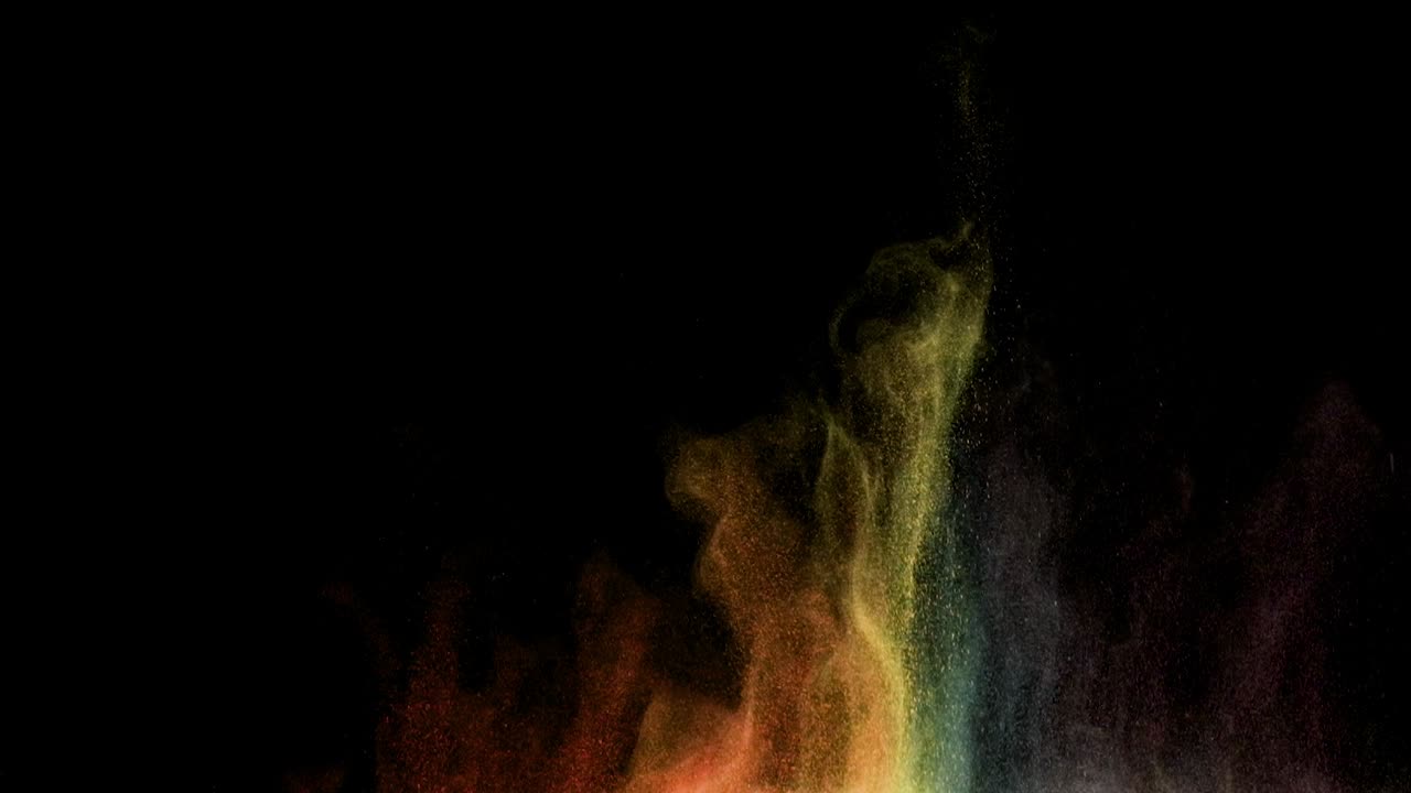 A explosão brilhante e colorida de pequenas partículas. Câmera lenta