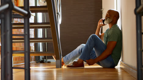 senior man talking on mobile phone at home 4k