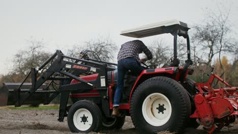 farmer operating a tractor in a field