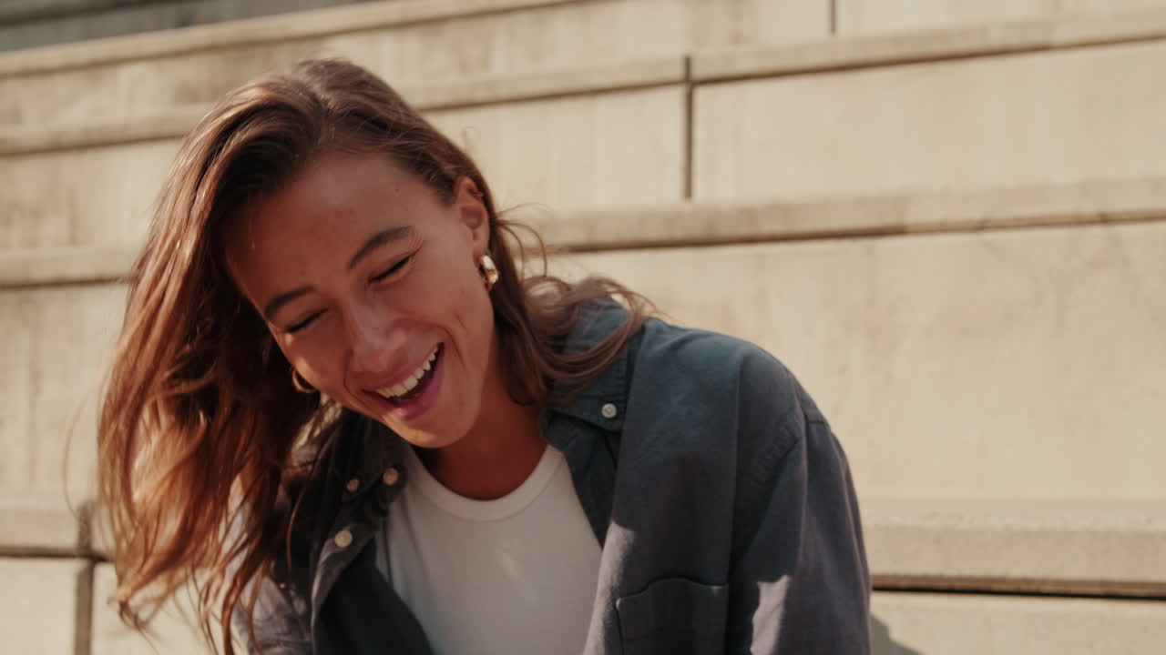 Portrait of a carefree student girl talking to friends
