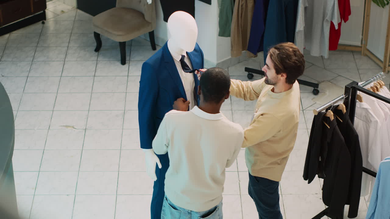 Clothing store with employees and a mannequin