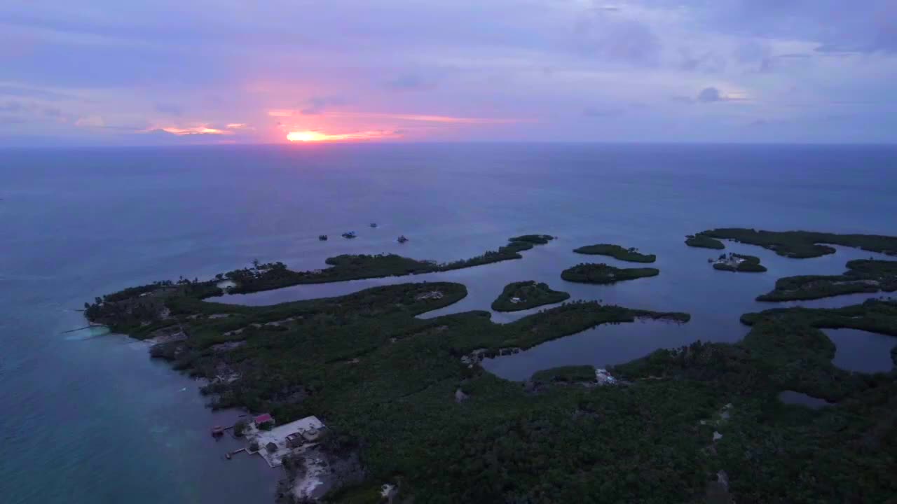 Tintipan island full of lagoons with sun setting in horizon