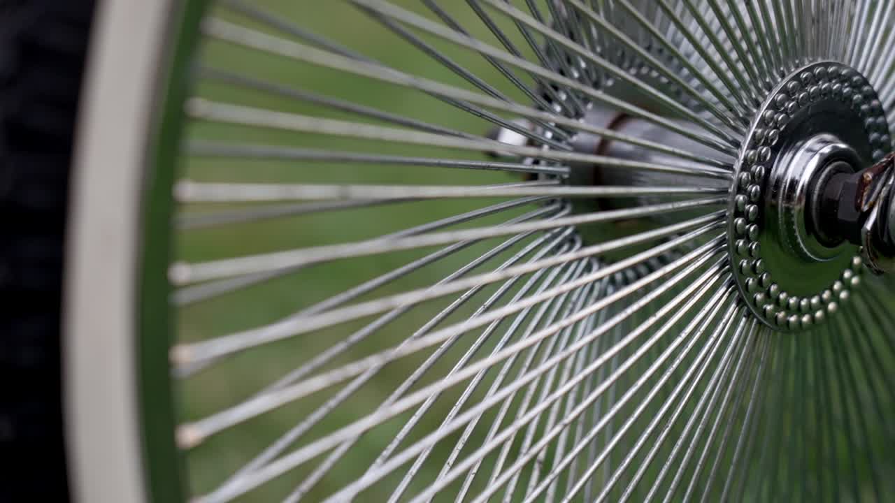 Close-up of a bicycle wheel with metal spokes