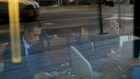 Asian-businessman-working-on-digital-tablet-in-a-modern-hotel-4k