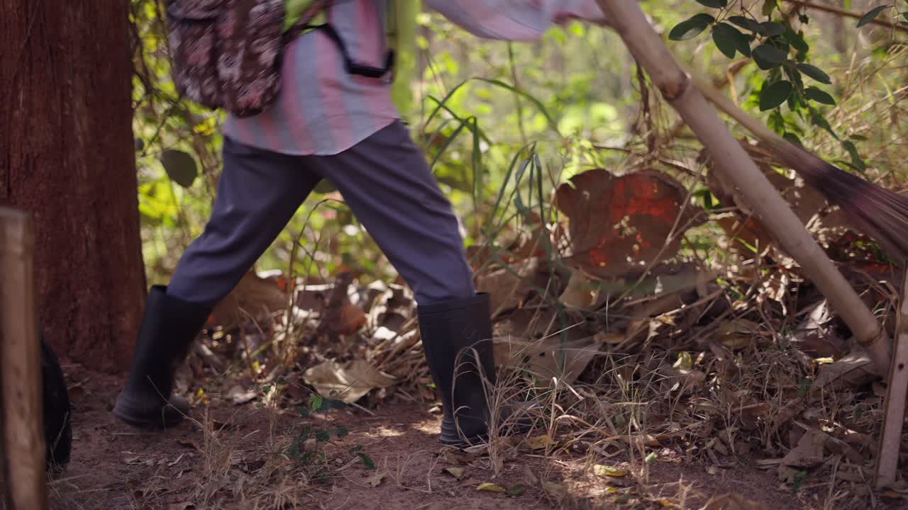 A person walking through a wooded area