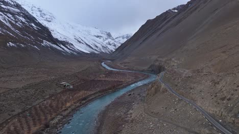 high mountain valley with river and road