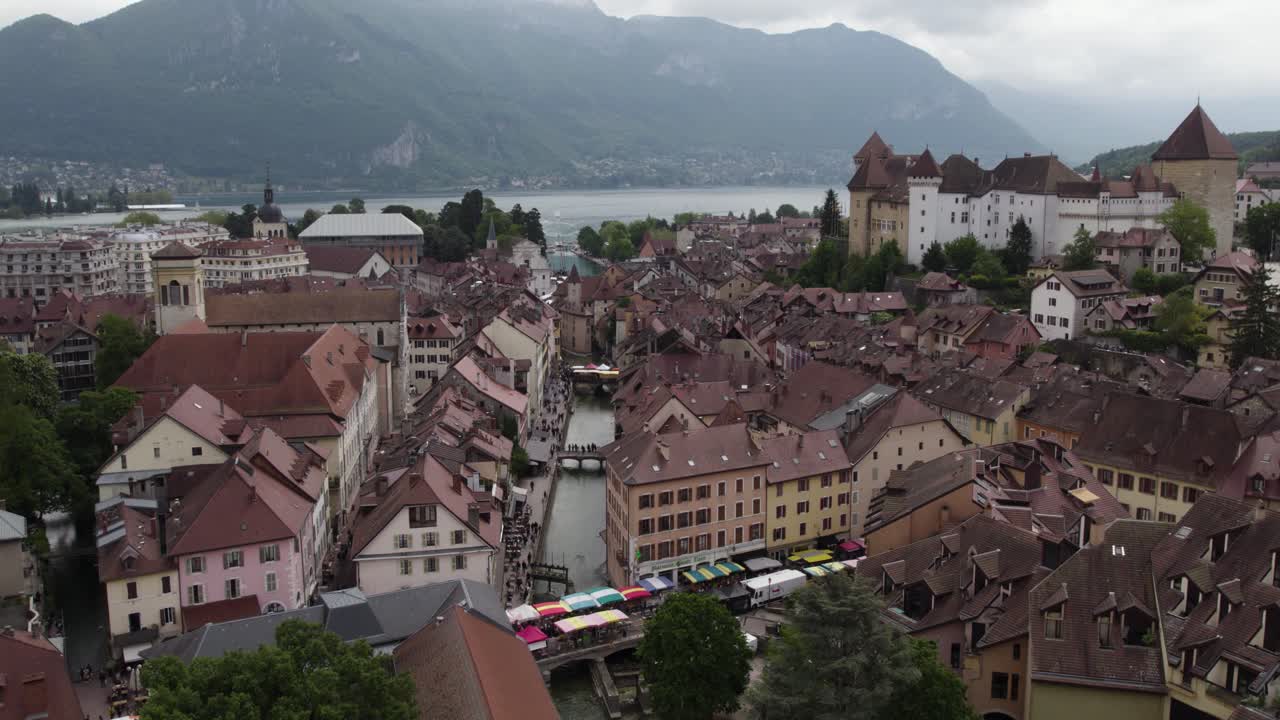 Farmer's Market on Annecy Canal Streets in France - Aerial Tilt-up