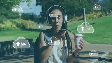 animation of clouds with arrows over woman talking on smartphone in a park