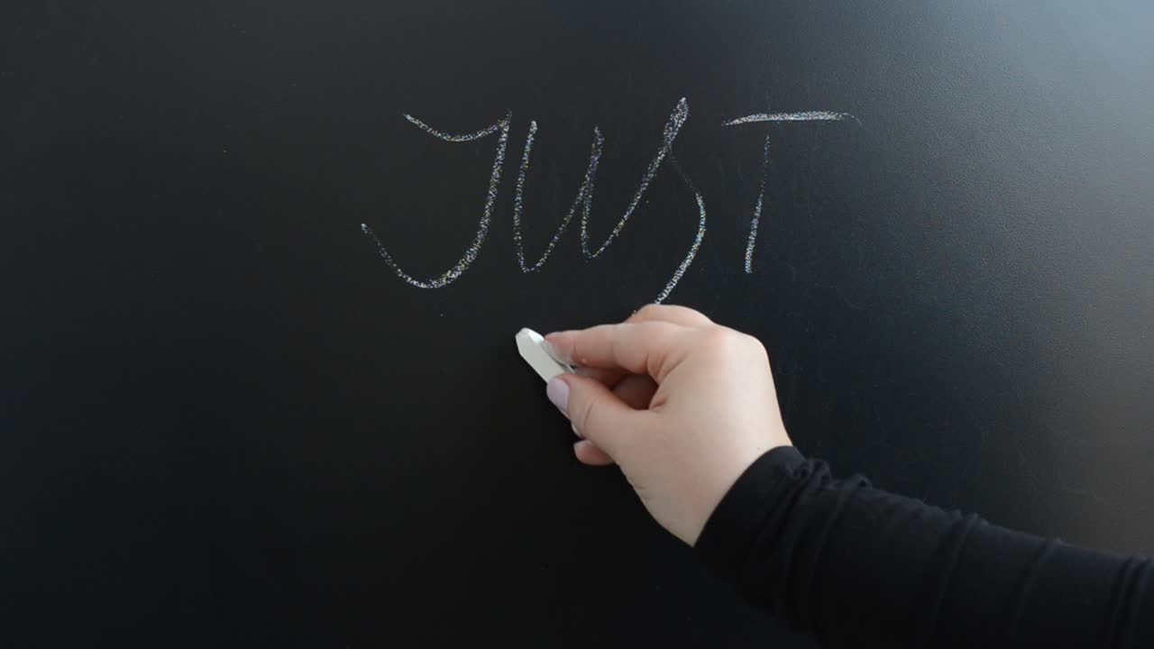 We write the popular phrase on a board. We write with chalk on a board