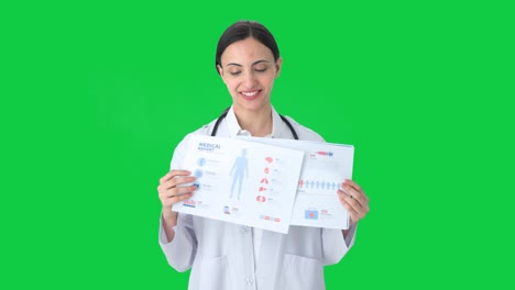 happy indian female doctor explaining medical reports to patient green screen