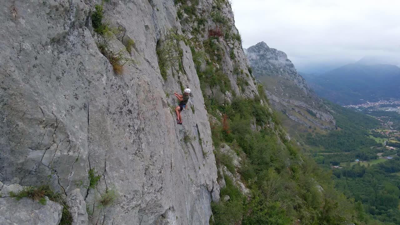 Close drone footage of a man lead climbing in the Pyrenees moutains at Tarascon sur Ari&egrave;ge
