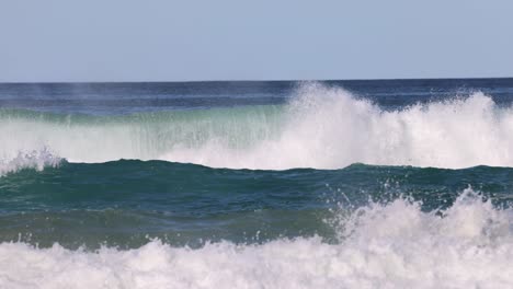 sequence of ocean waves breaking on the beach