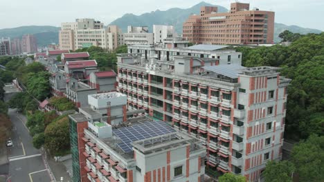 taiwanese urban landscape with residential buildings and solar panels, aerial view