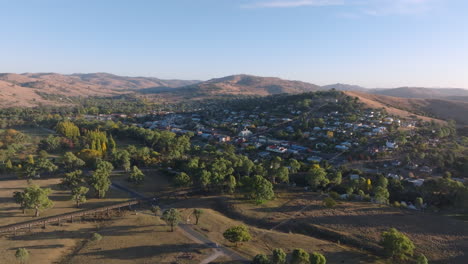 aerial: drone flying towards the town of gundagai in new south wales, australia