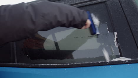 scraping ice off tinted car window