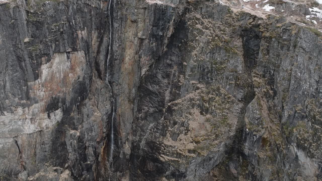 Aerial View of Voringfossen Waterfall in Early Spring, People on Observation Deck, Deep Canyon and Cliffs