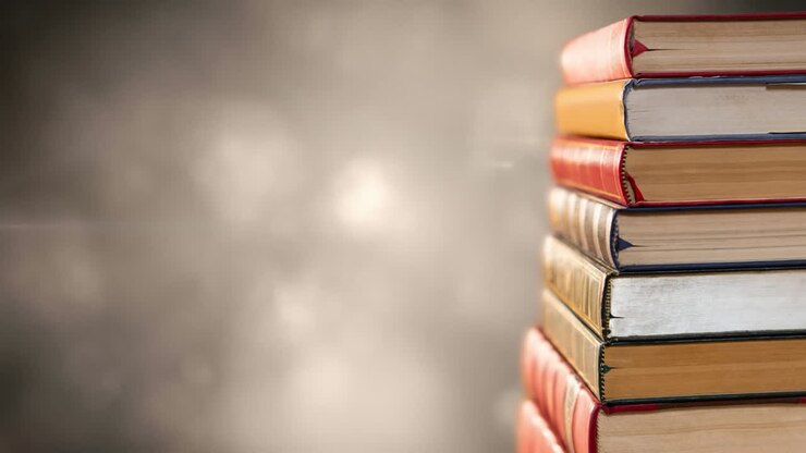 Animazione di pila di libri con spazio per il testo su luci brillanti