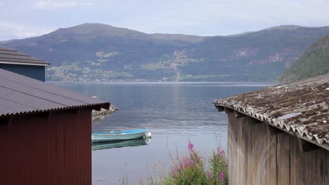 quiet norwegian lake and distant mountains