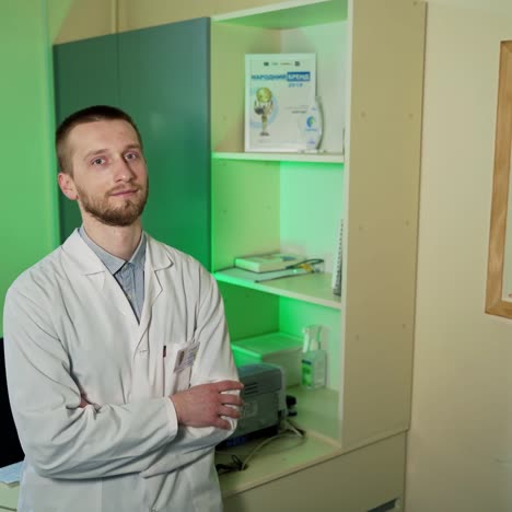 physician in white lab coat. doctor wearing white medical coat looking at camera