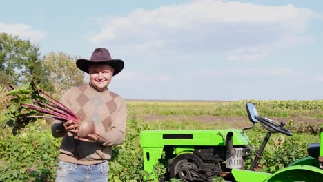 a rural worker keeps freshly picked red beets organically clean vegetables from a vegetable garden a rural worker keeps freshly picked red beets organically clean vegetables from a vegetable garden in the countryside agribusiness
