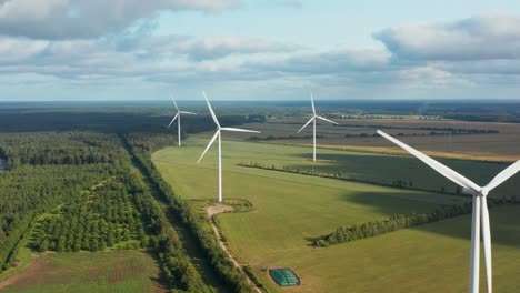 aerial view of a rotating wind turbine energy generation park