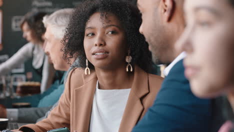 diverse-business-people-working-in-cafe-chatting-sharing-ideas-planning-deal-enjoying-collaborating-in-busy-coffee-shop-at-lunch