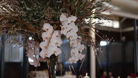 elegant tall white orchid wedding centerpiece