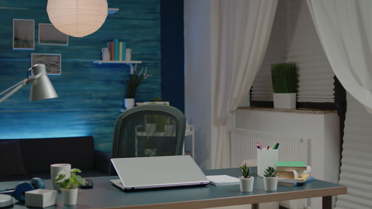 Businessman sitting at home doing remote work on laptop