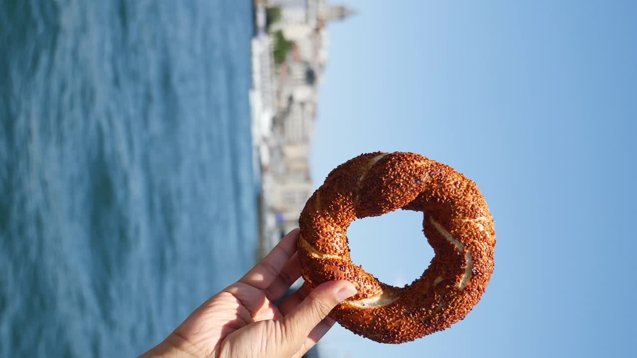 Simit in hand with a view