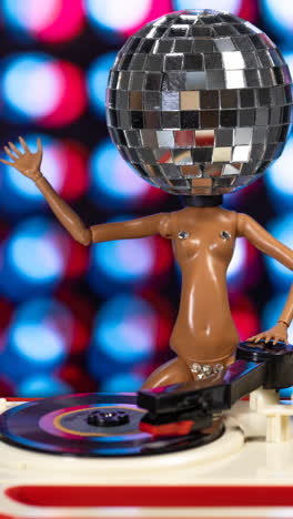 discodoll dancing on turntable