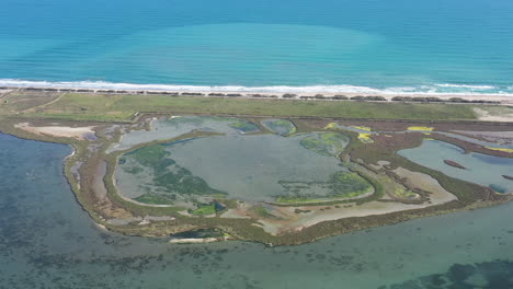 landscape with coastal ponds along the mediterranean sea aerial shot