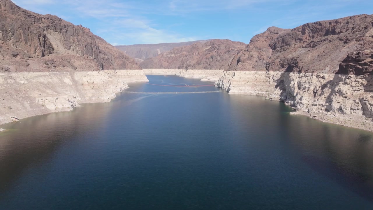 The Lake Mead Reservoir in Nevada that leads up to the Hoover Dam. The white mineral edge on the rocks around show the falling water level.