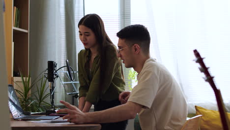 friends working with laptop together