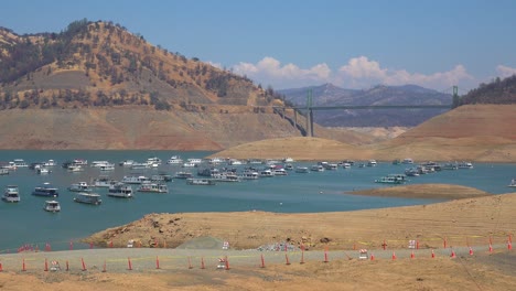 oroville lake california during extreme drought conditions with low water levels and burned trees