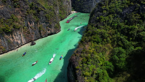 tourist boats entering in emerald waters of pileh lagoon