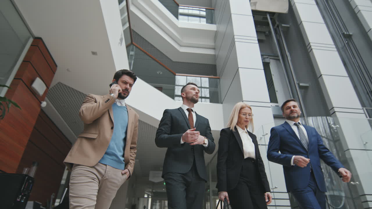 Business Partners with Lawyers Walking through Office