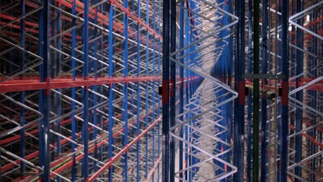 big and modern warehouse under construction, featuring metal shelving and other industrial equipment.