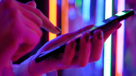 woman using smartphone at interactive exhibition - close up side view